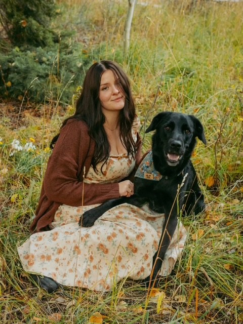 Cassidy smiling with her animals